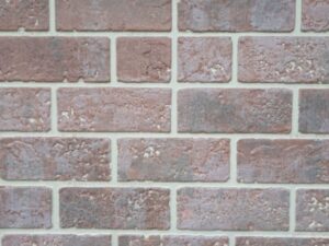 色褪せた赤茶色のレンガ壁テクスチャー